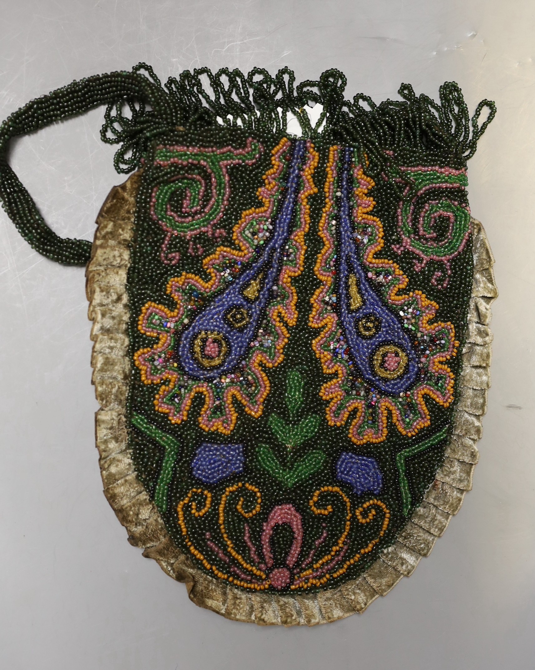 A collection of beadwork purses and bags from early 1900’s, including a W W I bead-worked purse dated 1916 with a steel frame surmounted with a building as the clasp, three beadwork bible bags, five beadwork purses and a